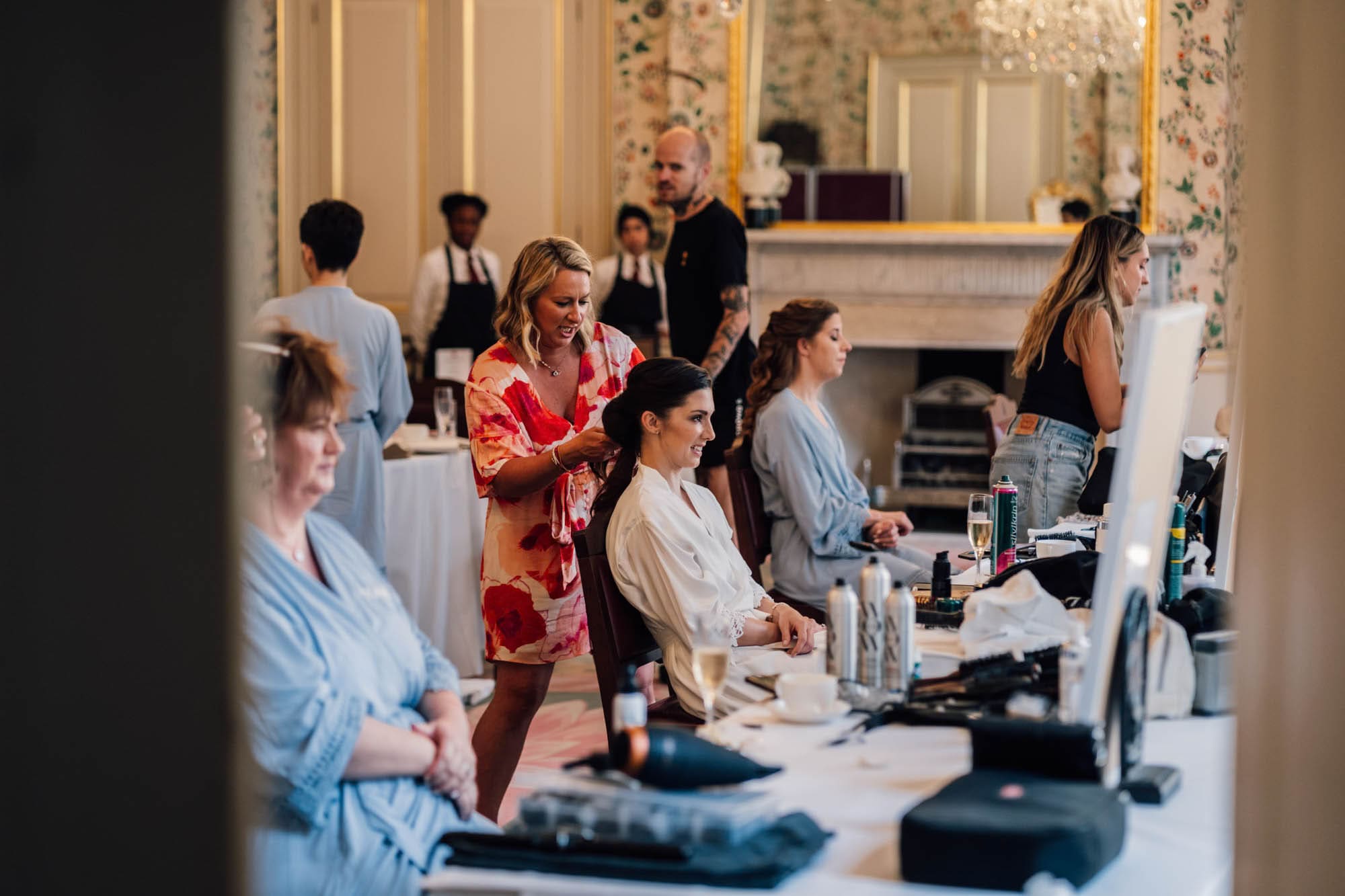mopping the groom's brow, captured in Merchant Taylors' Hall wedding photography, by Ben Lee