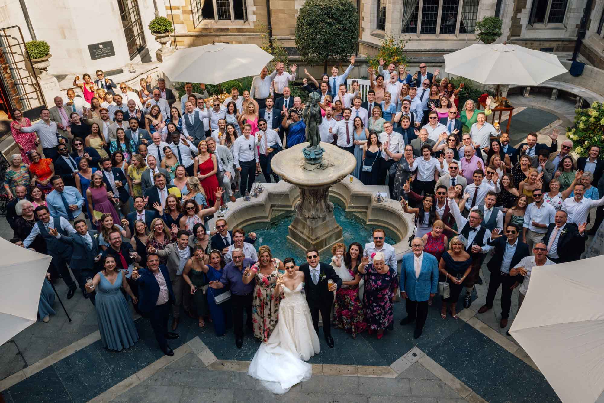 Group photo in the courtyard, captured in Merchant Taylors' Hall wedding photography, by Ben Lee.