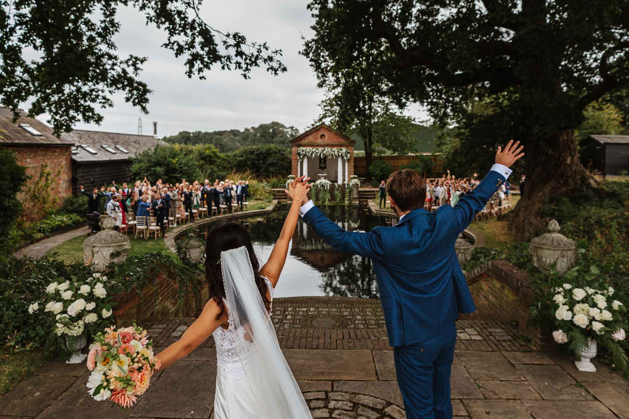 bride and groom celebrating their marriage, captured in Micklefield Hall wedding photography, by Ben Lee