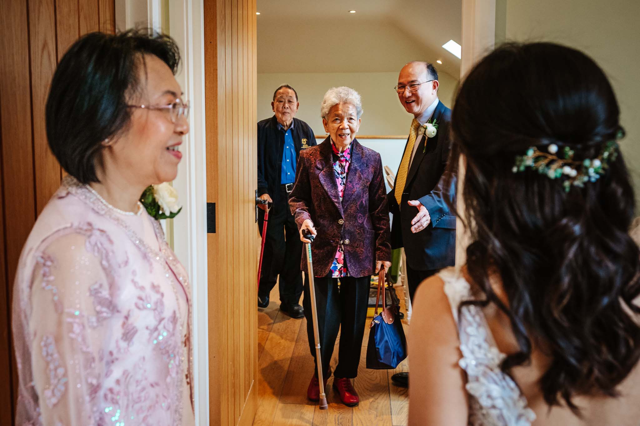 Bride meeting her family,  captured in Micklefield Hall wedding photography, by Ben Lee