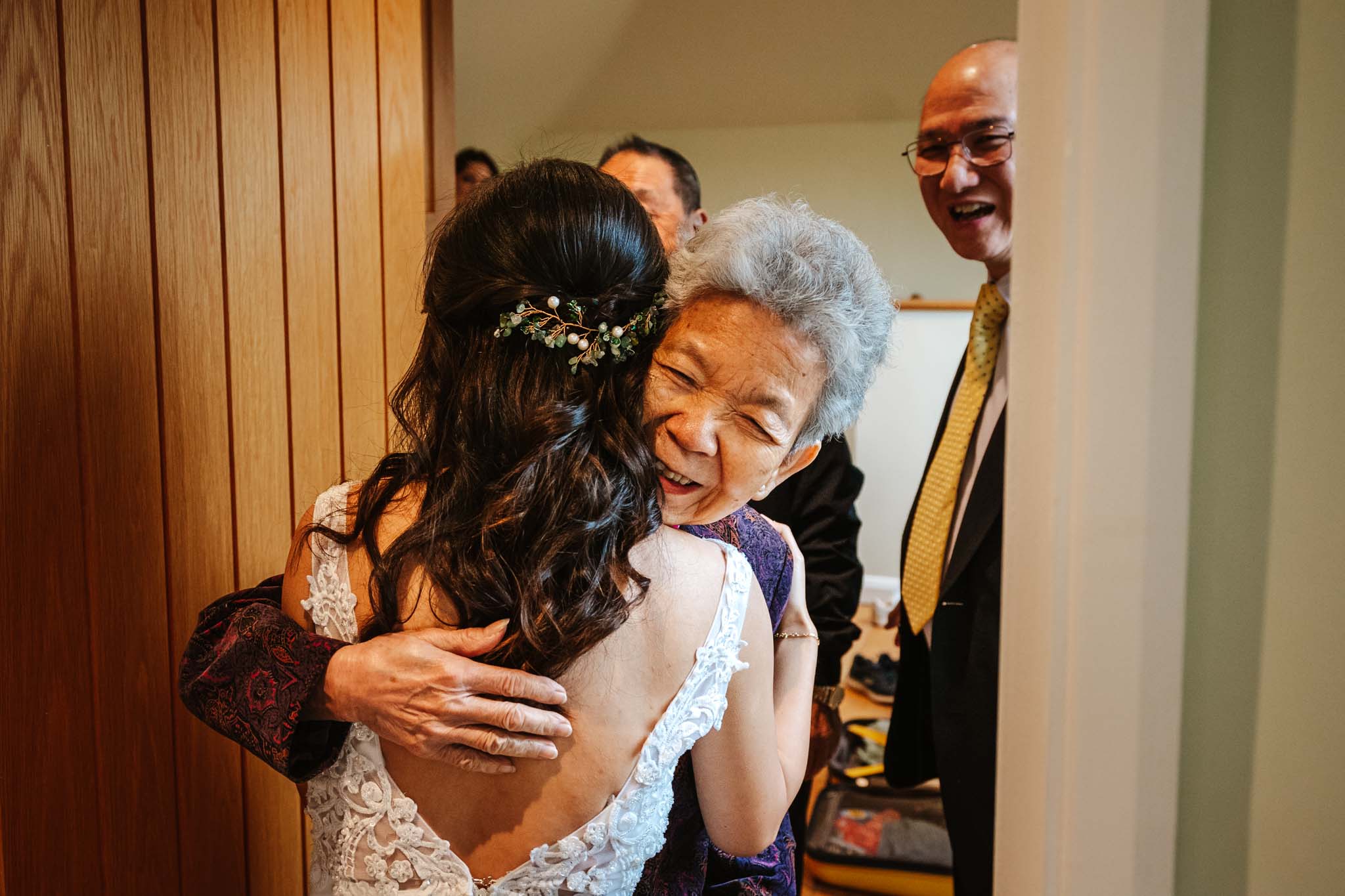 Hugs with family before getting married, captured in Micklefield Hall wedding photography, by Ben Lee