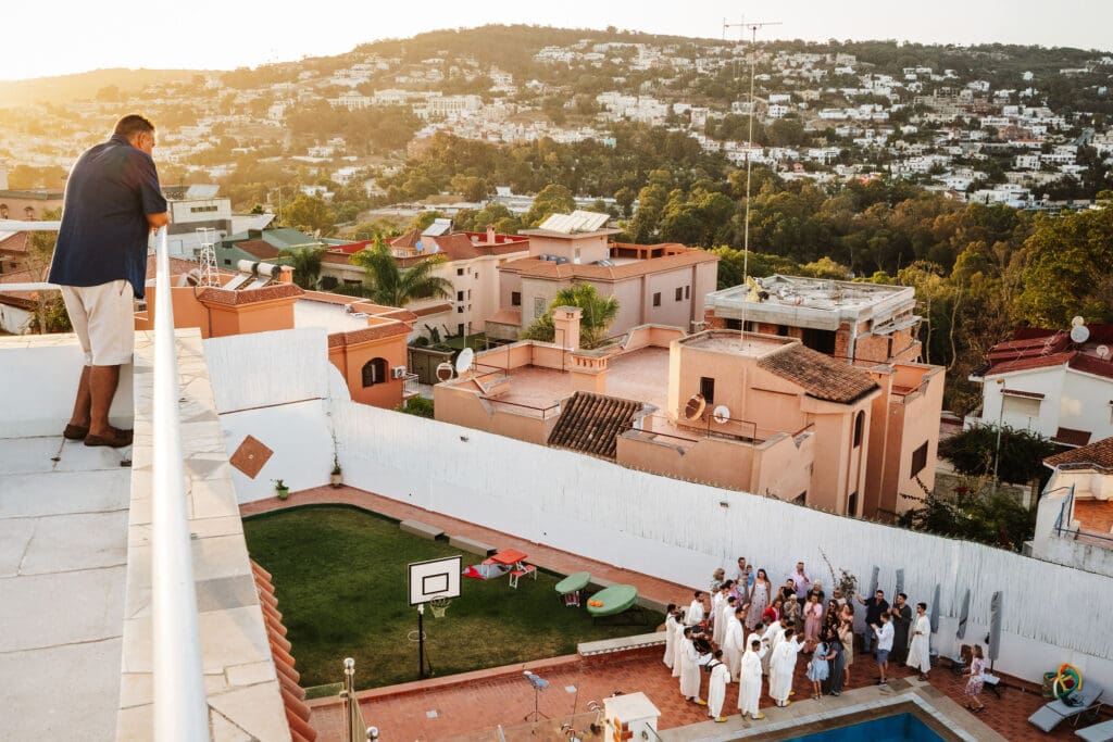 pre wedding pool party at villa overlooking hills captured in wedding photography in Tangier, Morocco by Ben Lee.