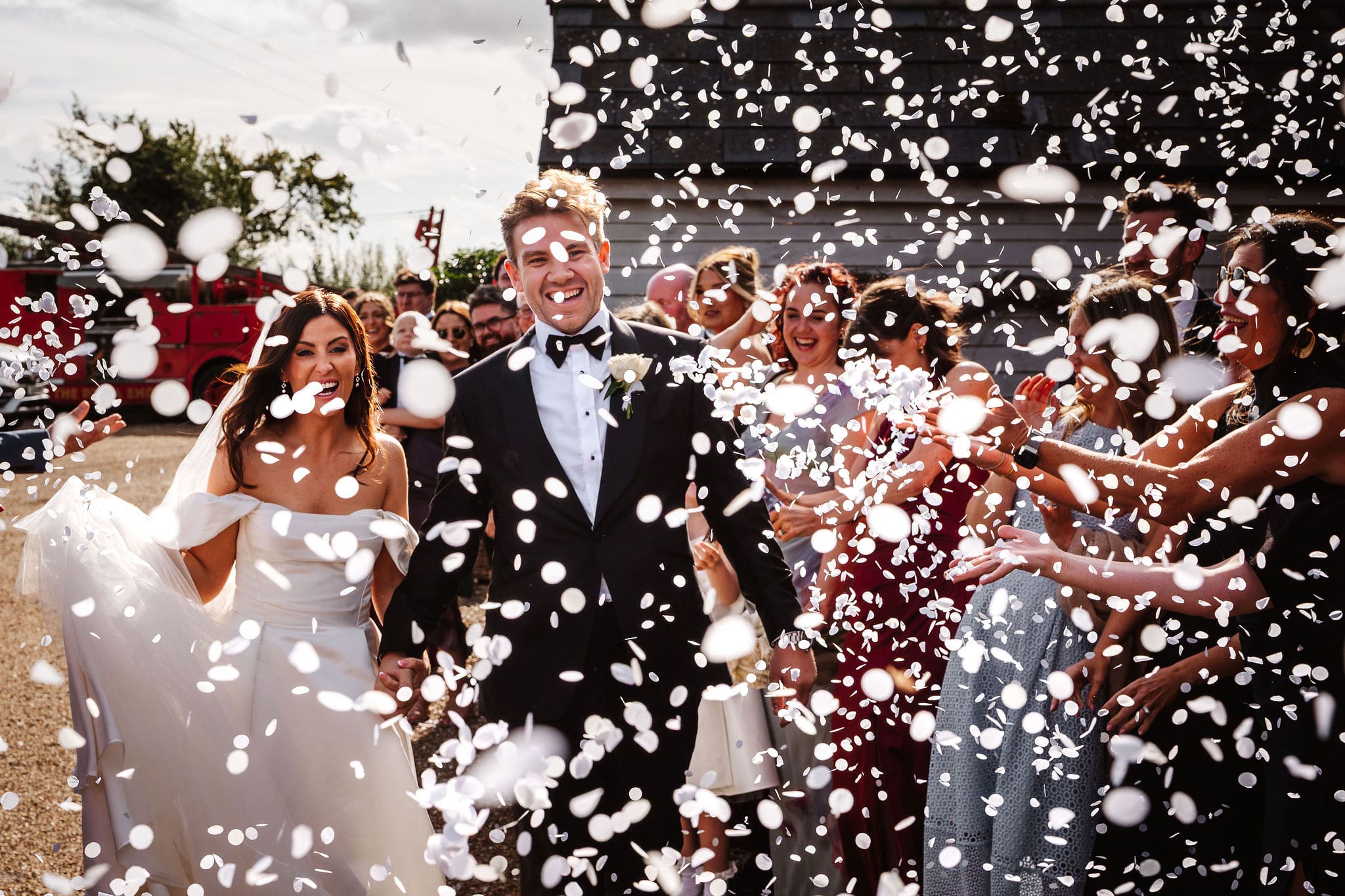 bride and groom in confetti, captured by Ben Lee photography