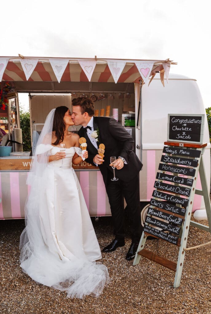 bride and groom kiss at ice cream truck, captured by Ben Lee Photography