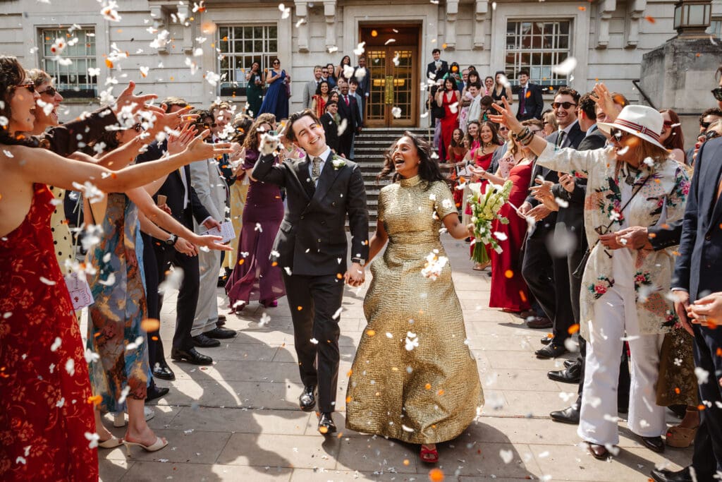 confetti moment with bride and groom during their wedding at the Libertine. Captured by Ben Lee Photography.