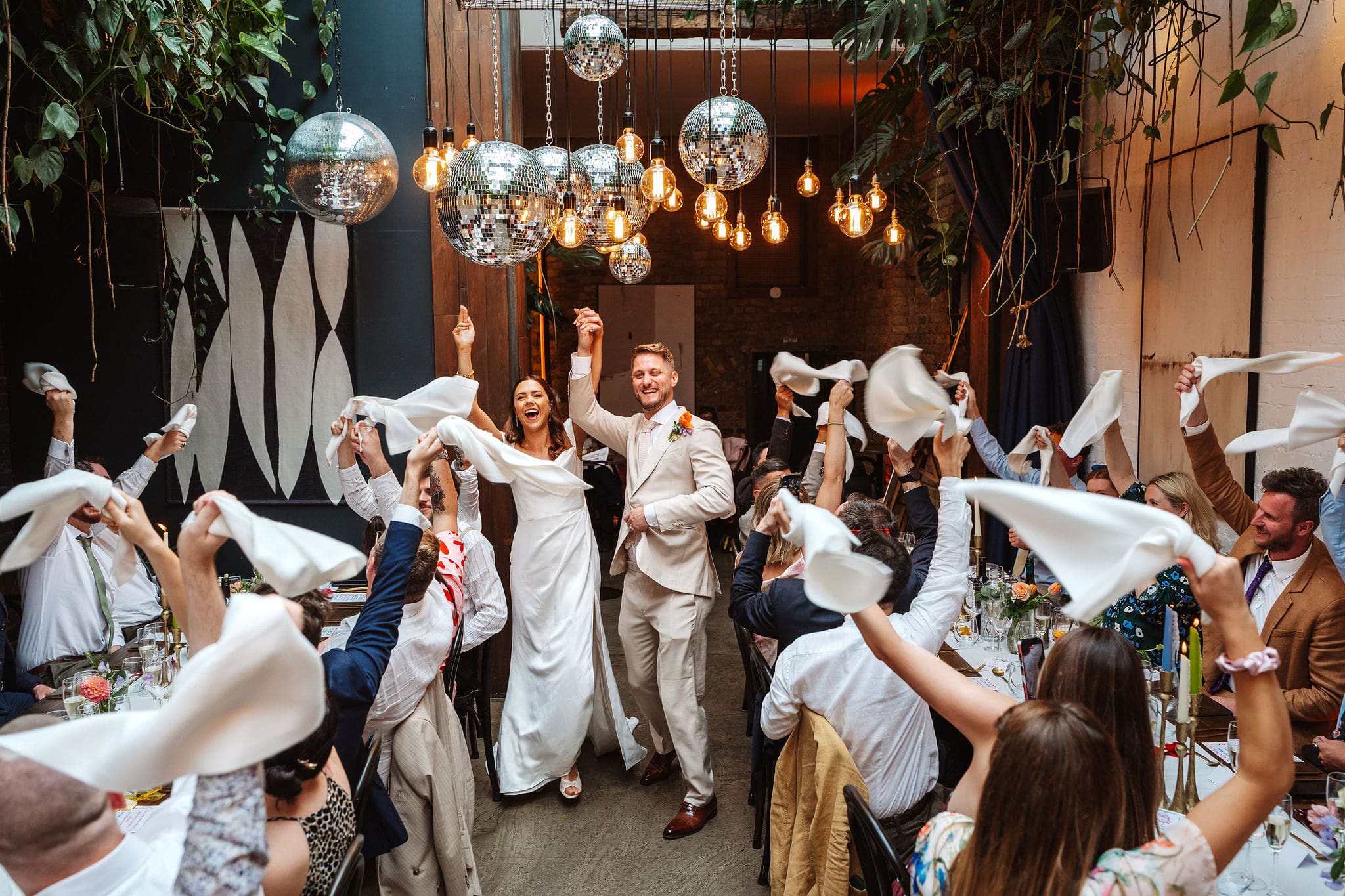 bride and groom enter the room to waving napkins at their Wedding at The Hackney, by Ben Lee Photography